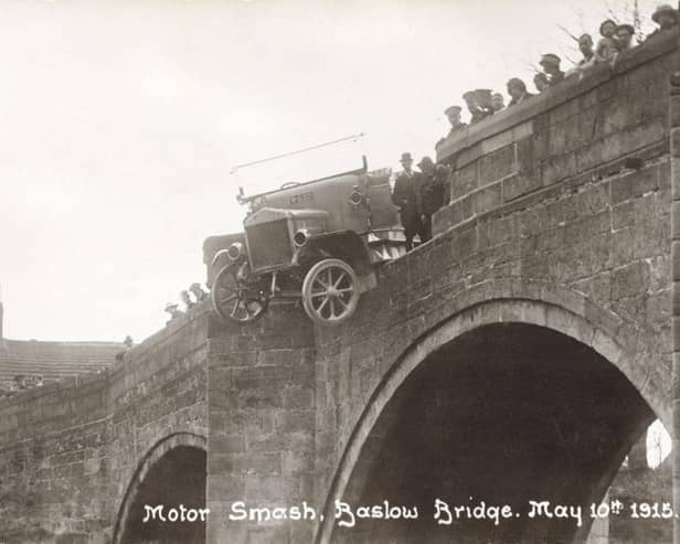 Baslow Bridge, 1915. A motor bus (Charabanc) accident, showing the bus balanced precariously over the parapet. Note that the vehicle has solid rubber tyres. The spectators are presumably the charabanc's passengers who have had a lucky escape. The stone bridge with cutwaters probably dates from the 17th century.  (Photo by NEMPR Picture the Past/Heritage Images/Getty Images)