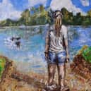 A vivid scene showing a girl paddling at a lake’s edge while looking over the water