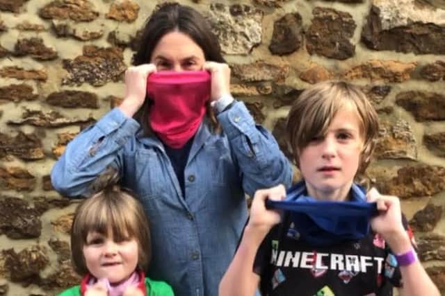 Helen Wright models a bandana with Charlie, 11 and Woody, 6