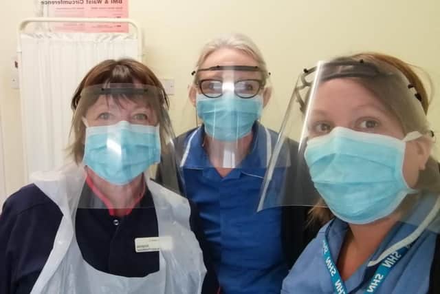 Chesterfield NHS workers with masks supplied by Stuart Murphy of Dronfield Lodge.