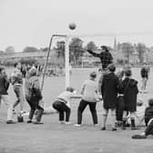 Local schoolboys watch the West German team training at Ashbourne during the 1966 World Cup in July 1966.