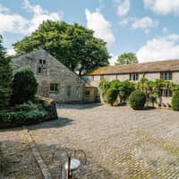 Look at the views from this stunning 18th century farmhouse with holiday cottages and five acres in Peak District - on the market for £1.1million
