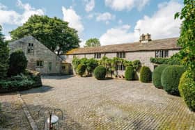 A farmhouse and two holiday let cottages are set within 5.25 acres of private grounds.