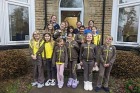 Tina Railton, back left, at Glenbrook with members of the 6th Buxton Methodist Brownies.