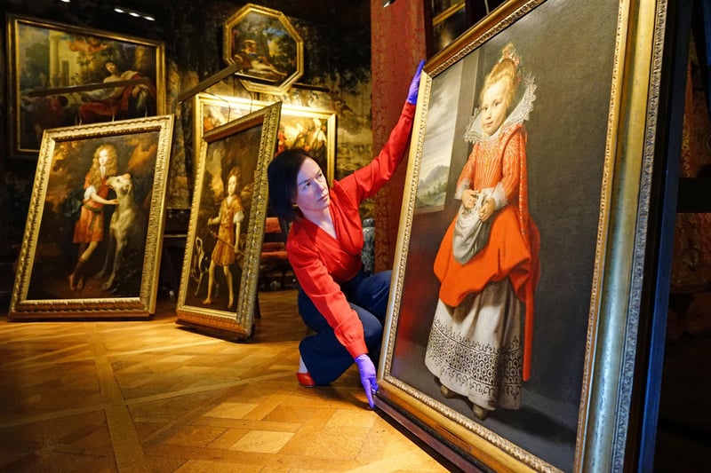 Gill Hart with the Artist daughter painting which inspired the Picturing Childhood exhibition.