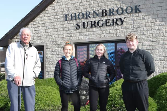 Stuart Boyt visits Thornbrook Surgery to thank volunteers Jess and Katie Christie and Sam Longden