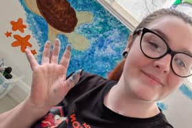 Kirsty Jackson from the High Peak Baby Bank painting an under the sea mural. Photo submitted