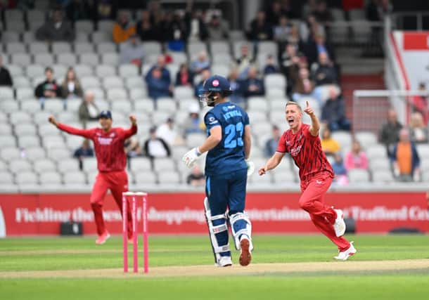 Luke Wood celebrates the wicket of Caleb Jewell with the first ball of the Derbyshire innings. Picture: Dan Adams/Lancashire CCC.