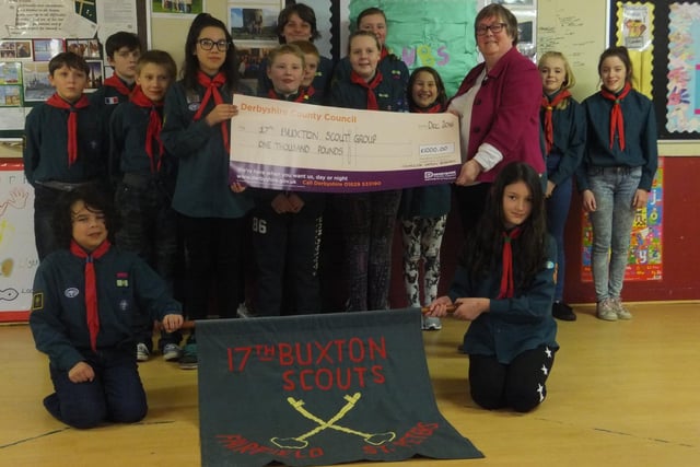 Members of 17th Buxton Scouts with a charity cheque.