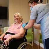 Woman receives her Covid-19 jab