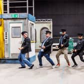 The cast of The Full Monty bust a move.
