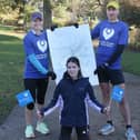 Sam Willis and Nick Jones prepare to run all the streets in Buxton with Sam's daughter Evie. Photo Jason Chadwick