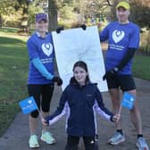Sam Willis and Nick Jones prepare to run all the streets in Buxton with Sam's daughter Evie. Photo Jason Chadwick