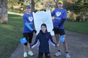 Sam Willis and Nick Jones prepare to run all the streets in Buxton with Sam's daughter Evie. Photo Jason Chadwick