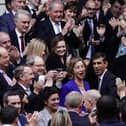 Rishi Sunak is congratulated as he arrives at Conservative party HQ in Westminster, London, after it was announced he will become the new leader of the Conservative party after rival Penny Mordaunt dropped out.