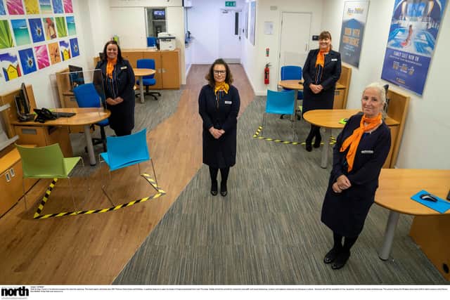 Staff at Hays Travel prepare for reopening with social distancing, screens and hygiene measures in place.