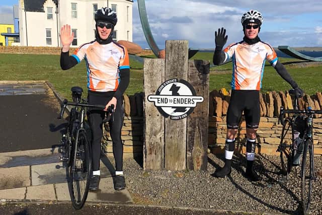 Lucas Parker and Isaac Brown at the start of their journey in John O'Groats.