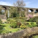 There are few telltale signs of the 21st century in this picture from John Moss, taken at the junction of Hayfield Road and Bowden Lane in Chapel Milton, where the Victorian bifurcated rail viaduct passes over Black Brook.