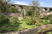 There are few telltale signs of the 21st century in this picture from John Moss, taken at the junction of Hayfield Road and Bowden Lane in Chapel Milton, where the Victorian bifurcated rail viaduct passes over Black Brook.