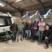 The Buxton well dressing lifters and shifters volunteers team . Photo Michael Hilton