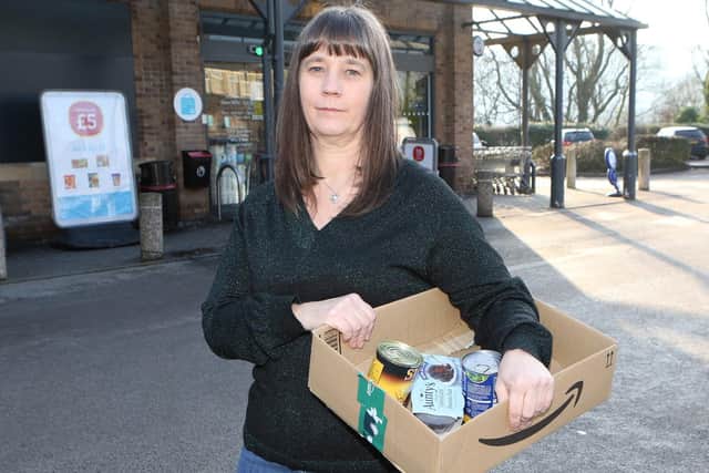 Food bank volunteer Zena Aris-Sutton at one of their donation points at the Co-op store