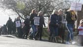 Protesters arch to the town hall.