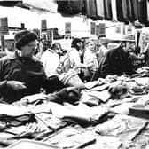 Visitors to Bakewell Market are pictured looking for some bargains in 1976.
