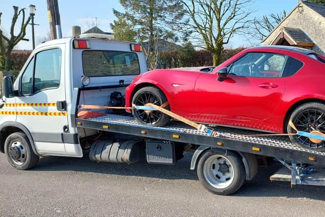 Sue Waldron's car had to be towed away for repairs after she hit the pothole in March.
