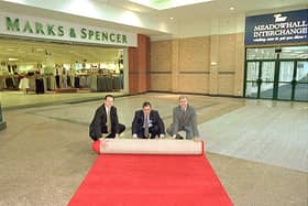 Marks & Spencer Meadowhall rolled out the red carpet for customers at the Meadowhall Centre for the opening of the new link between the Interchange bridge at the front of the store in 1999. Left to right, Darren Pearce, Finance Manager at Meadowhall Centre, Peter Walker, South Yorkshire Passenger Executive and Stefan Andrejczuk, M & S Meadowhall Store Manager.