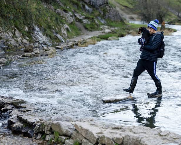 These visitor to the Dovedale stepping stoneson Friday, November 24, had to tread carefully. (Photo: Rod Kirkpatrick/RKP Photography)