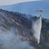 Two helicopters have been called in to help tackle the blaze