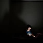 Child on a smartphone. (Photo: MARVIN RECINOS/AFP via Getty Images)