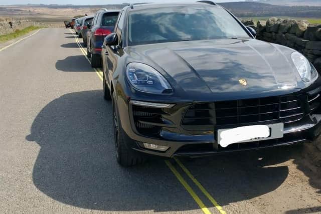 Derbyshire police posted this picture of cars parked on double-yellow lines at Curbar Edge, Derbyshire.