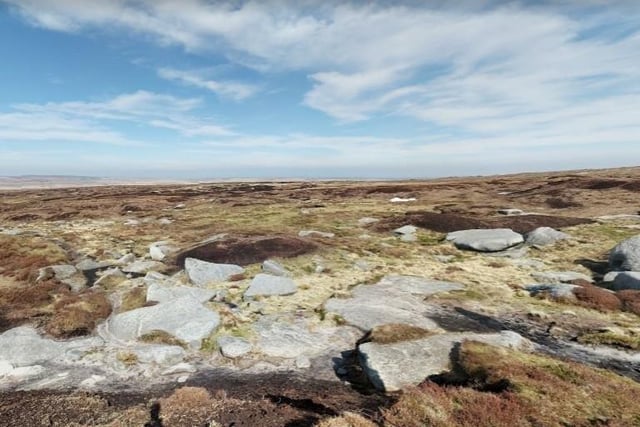 Which Peak, the second highest point in Derbyshire, has been described as one of Britain's only true deserts because of its expanse of virtually featureless moorland?
