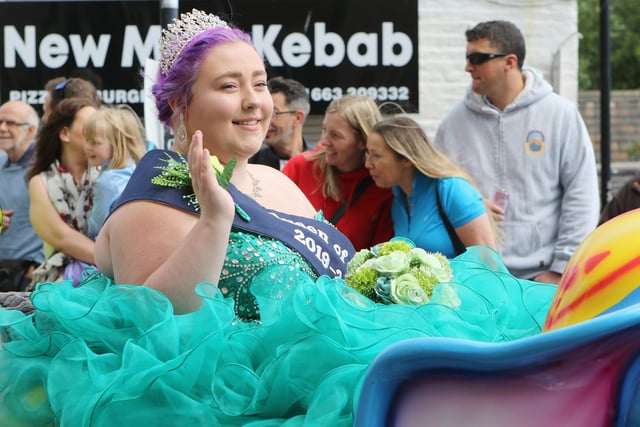 A wave from a carnival queen at New Mills Carnival