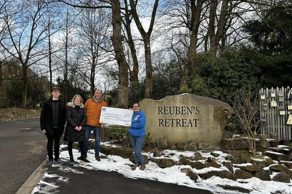 High Peak Board Gamers present cheque to Reuben's Retreat