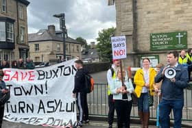 Dozens of people gathered to protest outside Buxton Methodist Church