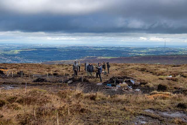 Volunteers work in difficult conditions in the search for lost WW2 American airman Corporal Clarence Watson at Twizle Head Moss Crash Site on Holme Moss near Holmfirth. Picture by Tony Johnson.