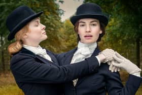 Emily Beecham (Fanny) and Lily James (Linda) in BBC 1's The Pursuit of Love. Photo credit:  Theodora Fims & Moonage Pictures Limited/ Robert Viglasky.