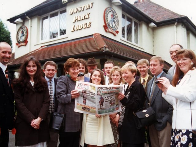 Tom Cobleigh managers check the racing format as they prepared to leave for a day at the races back in 1997