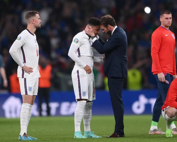 Gareth Southgate consoles Jadon Sancho after the penalties defeat to Italy.