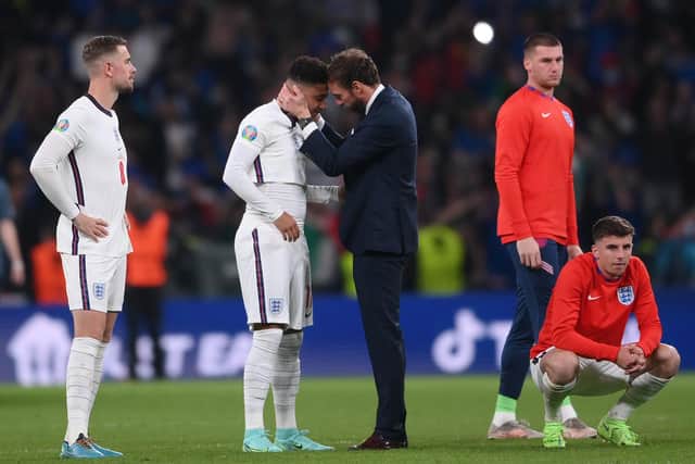 Gareth Southgate consoles Jadon Sancho after the penalties defeat to Italy.