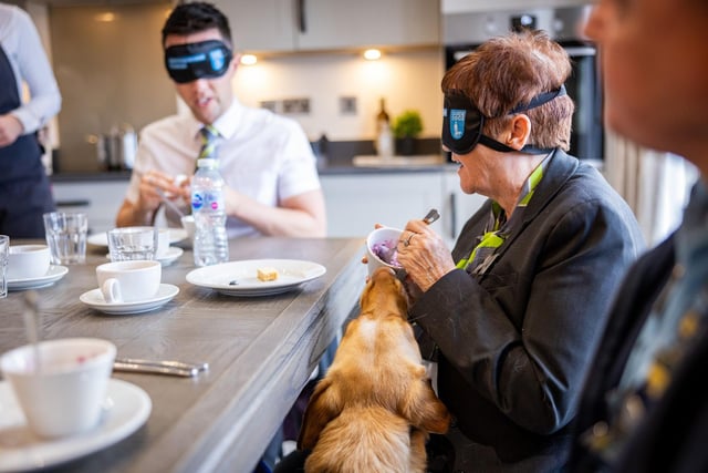 BM - dark 280325 126 - Sales Advisers Stefan Philipps and Cherry Pomfrey taking on the Dinner in the Dark