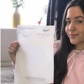 Amy Lee, proudly displaying her grade four GCSE maths result, achieved with help from tutors at Buxton & Leek College.