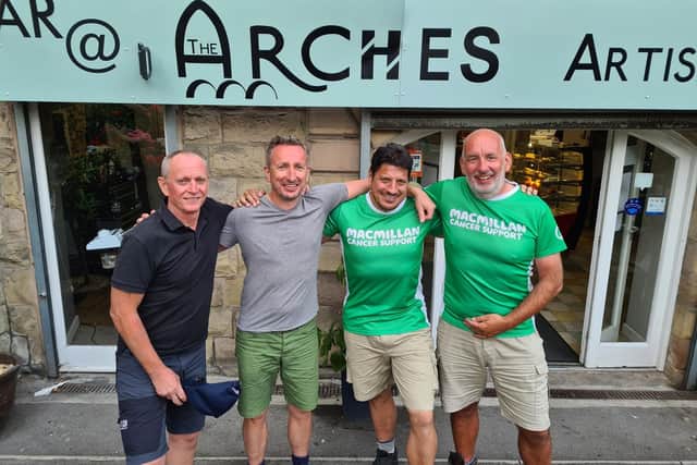 From left, mighty hikers Steve Toy, Charlie Lenox, Jason Barford and Peter White, celebrated the end of their journey at the Arches.