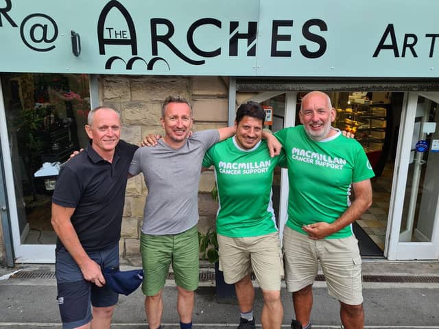 From left, mighty hikers Steve Toy, Charlie Lenox, Jason Barford and Peter White, celebrated the end of their journey at the Arches.
