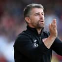 Stephen Robinson has warned his Morecambe players that they must improve if they want to avoid FA Cup embarrassment at Buxton. The Shrimps go into the game following a 4-0 defeat at MK Dons.