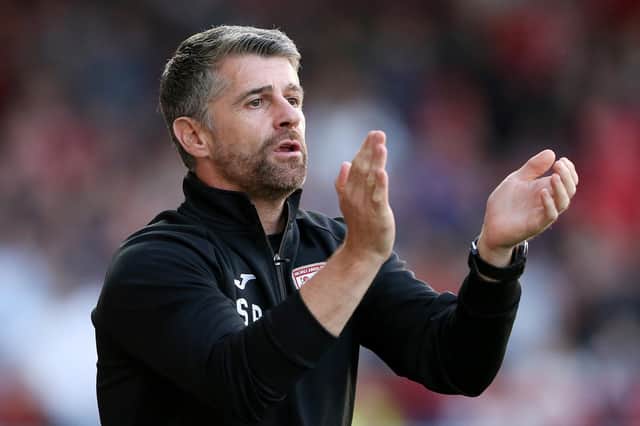 Stephen Robinson has warned his Morecambe players that they must improve if they want to avoid FA Cup embarrassment at Buxton. The Shrimps go into the game following a 4-0 defeat at MK Dons.