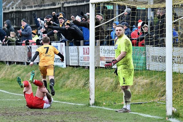 Adam Muir celebrates the third goal with fans. Photo by John Fryer.