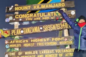Ian Clemson at the top of Mount Kilimanjaro.